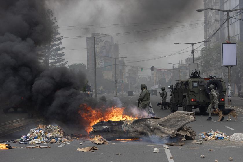 Anti-riot police officers with their dogs walk down Eduardo Mondlane Avenue past burning barricades made by protesters in Maputo November 7, 2024. Tensions were rising on November 7, 2024 in Mozambique's capital Maputo as police fired tear gas to disperse protesters gathered after the main opposition leader called to demonstrate election results. The southern African nation has been rocked by violence since an October 9 vote won by the Frelimo party, which has been in power for almost 50 years. ALFREDO ZUNIGA / AFP Anti-riot police officers with their dogs walk down Eduardo Mondlane Avenue past burning barricades made by protesters in Maputo November 7, 2024. Tensions were rising on November 7, 2024 in Mozambique's capital Maputo as police fired tear gas to disperse protesters gathered after the main opposition leader called to demonstrate election results. The southern African nation has been rocked by violence since an October 9 vote won by the Frelimo party, which has been in power for almost 50 years. ALFREDO ZUNI