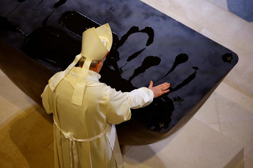Paris' Archbishop Laurent Ulrich spreads holy oil on the altar during the inaugural Mass, with the consecration of the high altar, at the Notre-Dame de Paris Cathedral in Paris, France, 08 December 2024. The Notre Dame de Paris Cathedral reopened on 07 December after nearly six years of renovation work following its destruction by a fire on 15 April 2019. EPA/SARAH MEYSSONNIER / POOL MAXPPP OUT Paris' Archbishop Laurent Ulrich spreads holy oil on the altar during the inaugural Mass, with the consecration of the high altar, at the Notre-Dame de Paris Cathedral in Paris, France, 08 December 2024. The Notre Dame de Paris Cathedral reopened on 07 December after nearly six years of renovation work following its destruction by a fire on 15 April 2019. EPA/SARAH MEYSSONNIER / POOL MAXPPP OUT