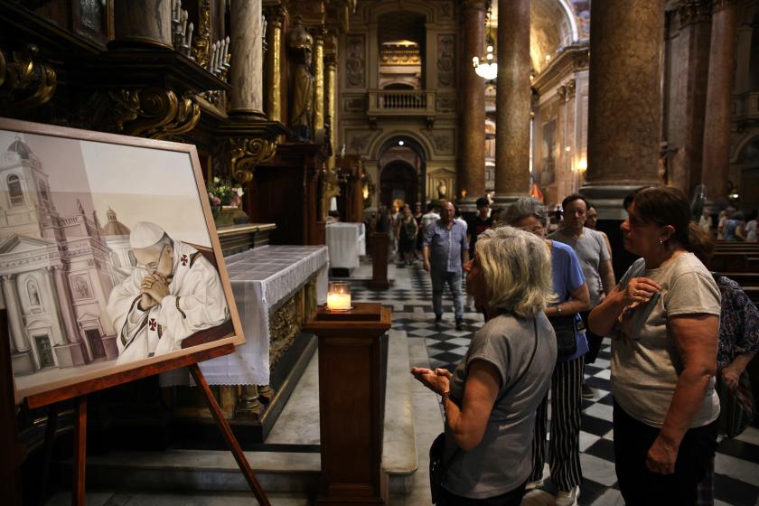 Women look at a painting depicting Pope Francis at the Basilica San Jose de Flores in Buenos Aires on February 23, 2025. Pope Francis's ninth night in hospital passed peacefully after a respiratory attack that sparked alarm, the Vatican said Sunday, although the 88-year-old is still using oxygen through a tube to the nostrils. Emiliano Lasalvia / AFP Women look at a painting depicting Pope Francis at the Basilica San Jose de Flores in Buenos Aires on February 23, 2025. Pope Francis's ninth night in hospital passed peacefully after a respiratory attack that sparked alarm, the Vatican said Sunday, although the 88-year-old is still using oxygen through a tube to the nostrils. Emiliano Lasalvia / AFP