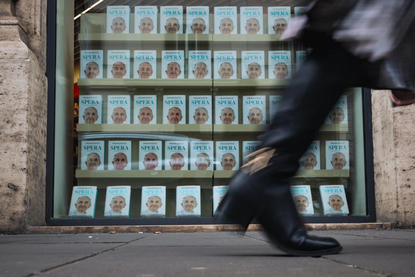 A pedestrian walks past a bookstore displaying books of the autobiography of late Pope Francis in Rome on April 24, 2025. Andrej ISAKOVIC / AFP A pedestrian walks past a bookstore displaying books of the autobiography of late Pope Francis in Rome on April 24, 2025. Andrej ISAKOVIC / AFP