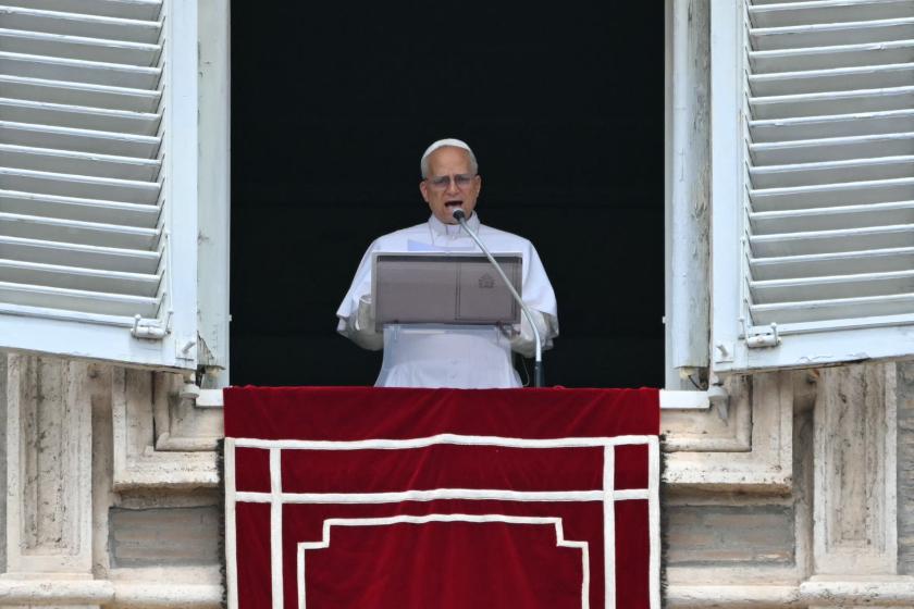 Pope Leo XIV addresses the crowd from the window of the apostolic palace overlooking St. Peter's square during the Angelus prayer in The Vatican on June 22, 2025. Andreas SOLARO / AFP