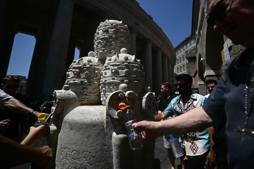 People fill their bottle with water at a fountain near the Vatican on June 26, 2025. Filippo MONTEFORTE / AFP People fill their bottle with water at a fountain near the Vatican on June 26, 2025. Filippo MONTEFORTE / AFP