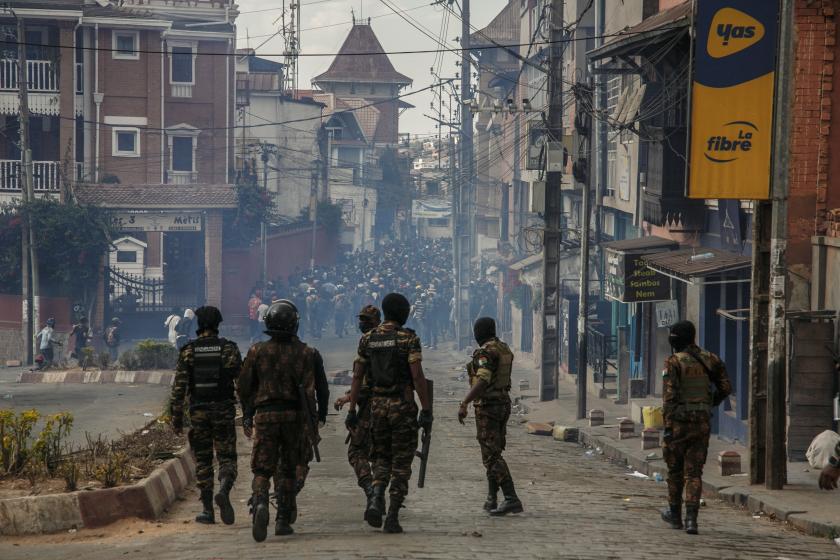 Security forces line up as they approach protesters during a demonstration against repeated water and electricity outages in Antananarivo on September 30, 2025. Protesters in Madagascar gathered for new demonstrations September 30, 2025, a day after Madagascar's President Andry Rajoelina sacked his government in a bid to quell days of unrest that has left 22 people dead, according to the UN. Inspired by "Gen Z" protests in Indonesia and Nepal, the youth-led movement has taken aim at ingrained misgovernance,