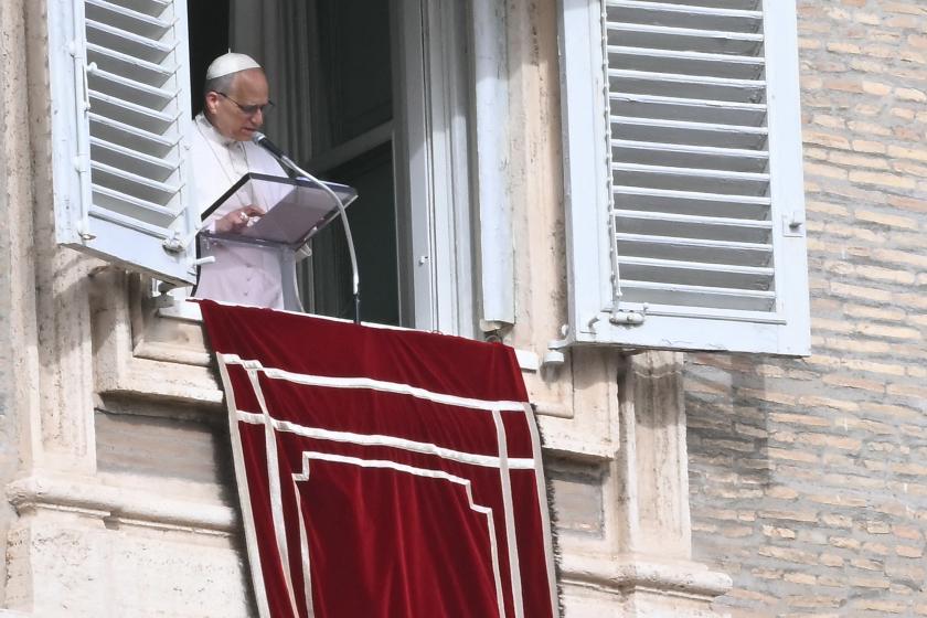 Pope Leo XIV addresses the crowd from the window of the apostolic palace overlooking St. Peter's square during the Angelus prayer in The Vatican on November 16, 2025. Filippo MONTEFORTE / AFP