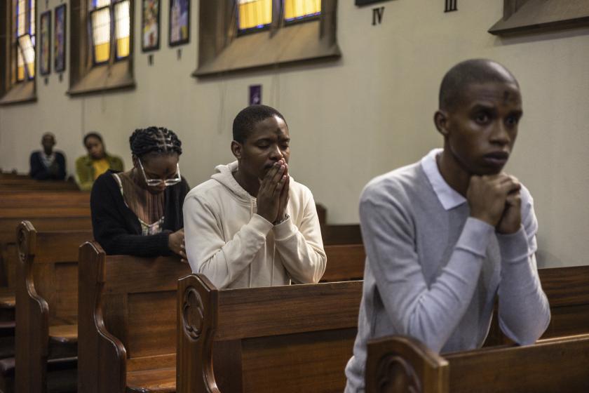 Catholics pray during the Ash Wednesday Mass at the Holy Trinity Catholic Church in Braamfontein, Johannesburg, on February 18, 2026. ILARIA FINIZIO / AFP