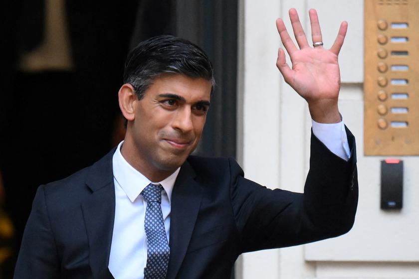 New Conservative Party leader and incoming prime minister Rishi Sunak waves as he leaves from Conservative Party Headquarters in central London having been announced as the winner of the Conservative Party leadership contest, on October 24, 2022. Britain's next prime minister, former finance chief Rishi Sunak, inherits a UK economy that was headed for recession even before the recent turmoil triggered by Liz Truss. Daniel LEAL / AFP