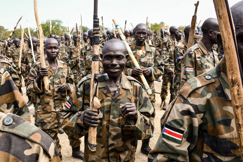 New members of South Sudan People's Defence Forces (SSPDF) of the Unified Forces attend with handmade wooden rifles or sticks during the graduation ceremony in Malakal on November 21, 2022. About nine thousand members including former soldiers of rebels in South Sudan's civil war were integrated into the country's Unified Forces after more than 3 years of training. Samir Bol / AFP New members of South Sudan People's Defence Forces (SSPDF) of the Unified Forces attend with handmade wooden rifles or sticks during the graduation ceremony in Malakal on November 21, 2022. About nine thousand members including former soldiers of rebels in South Sudan's civil war were integrated into the country's Unified Forces after more than 3 years of training. Samir Bol / AFP