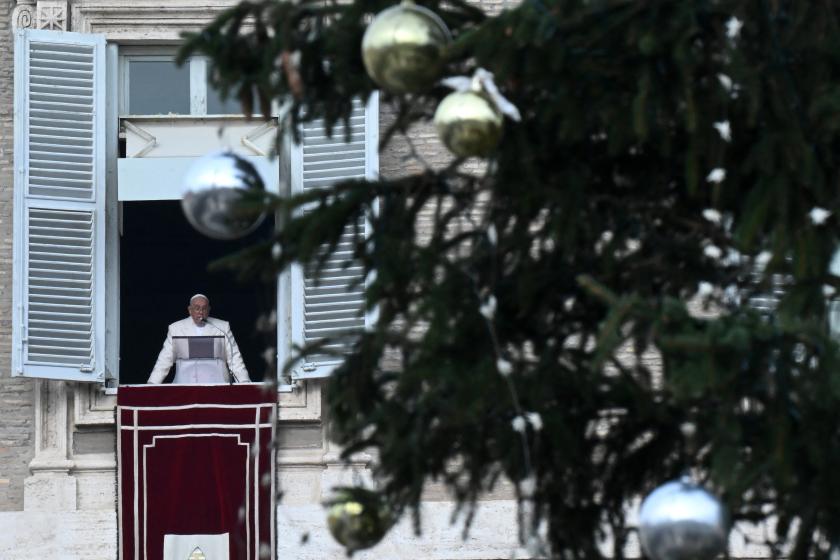 Pope Francis addresses the crowd from the window of the apostolic palace overlooking St. Peter's square as he celebrates the Solemnity of the Immaculate Conception with the midday recitation of the Angelus prayer on December 8, 2023 in The Vatican.  Filippo MONTEFORTE / AFP