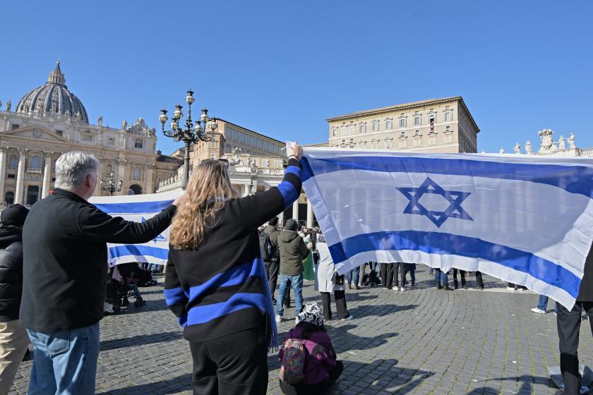German activists hold Israeli flags as Pope Francis waves to the crowd from the window of the Apostolic Palace overlooking St. Peter's Square in the Vatican, during the weekly Angelus prayer, on February 4, 2024. Andreas SOLARO / AFP German activists hold Israeli flags as Pope Francis waves to the crowd from the window of the Apostolic Palace overlooking St. Peter's Square in the Vatican, during the weekly Angelus prayer, on February 4, 2024. Andreas SOLARO / AFP