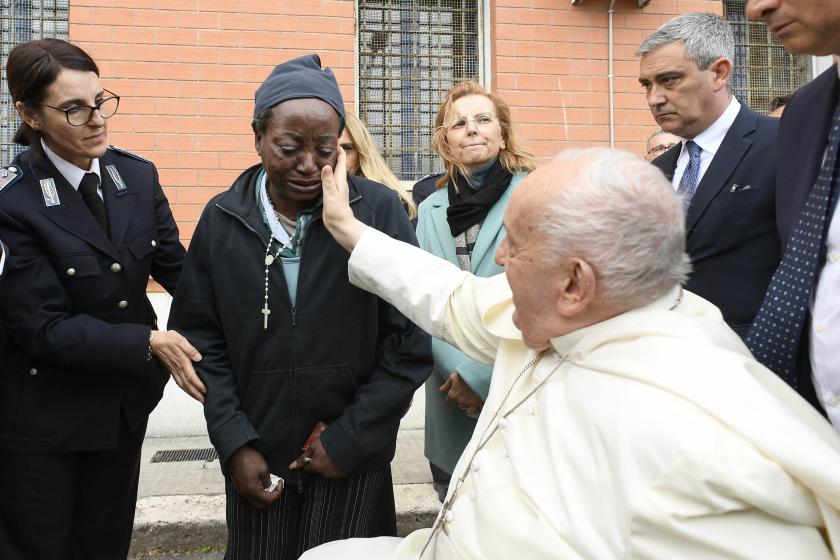 This photo taken and handout on March 28, 2024 by The Vatican Media shows Pope Francis as he arrives to perform the "Washing of the Feet" of inmates during a private visit at the Rebibbia prison for women in Rome as part of Holy Thursday, during Easter celebrations. Handout / VATICAN MEDIA