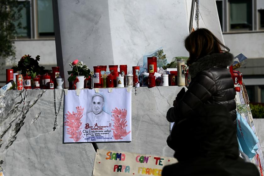 A woman prays at the statue of Pope John Paul II outside the Gemelli hospital where Pope Francis is hospitalized with pneumonia, in Rome on March 19, 2025. A woman prays at the statue of Pope John Paul II outside the Gemelli hospital where Pope Francis is hospitalized with pneumonia, in Rome on March 19, 2025.