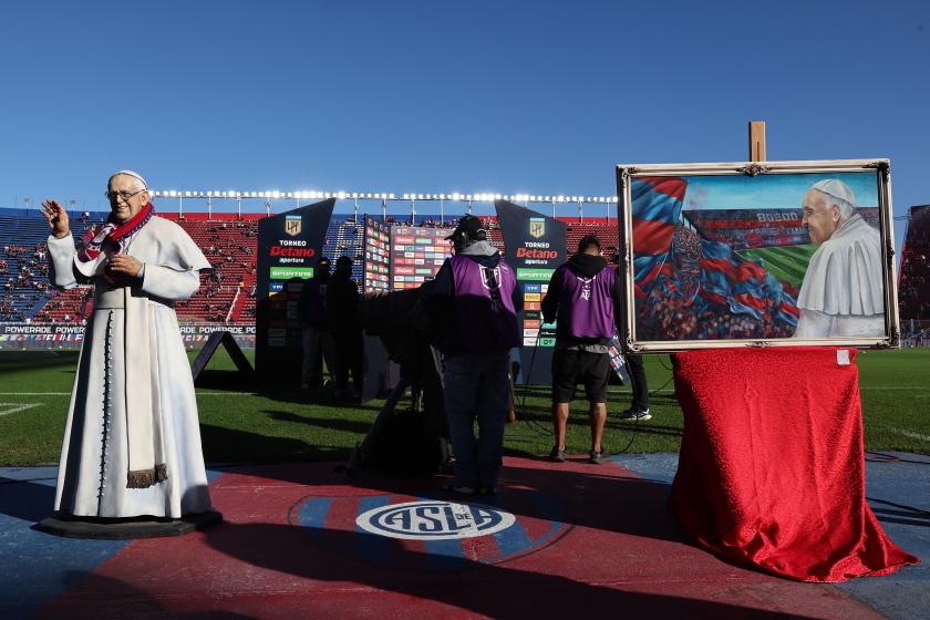 A statue depicting Pope Francis is displayed at the pitch before the start of the Argentine Professional Football League 2025 Apertura Tournament football match between San Lorenzo and Rosario Central at the Pedro Bidegain stadium in Buenos Aires on April 26, 2025. The late Pope Francis, Jorge Bergoglio, was a fan and member No. 88235 of Argentina's San Lorenzo football club. ALEJANDRO PAGNI / AFP