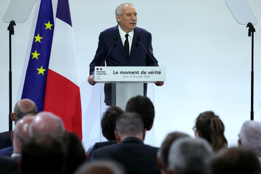 France's Prime Minister Francois Bayrou drinks as he gives an address to unveil the main guidelines of France's 2026 budget, a financial and political puzzle since it foresees a significant tightening of 40 billion in savings, in addition to increasing the military budget, in Paris on July 15, 2025. The aim is to reduce the deficit to 4.6% of GDP next year, down from 5.8% in 2024, in an international context that is volatile and uncertain, amid trade tensions. Thomas SAMSON / AFP