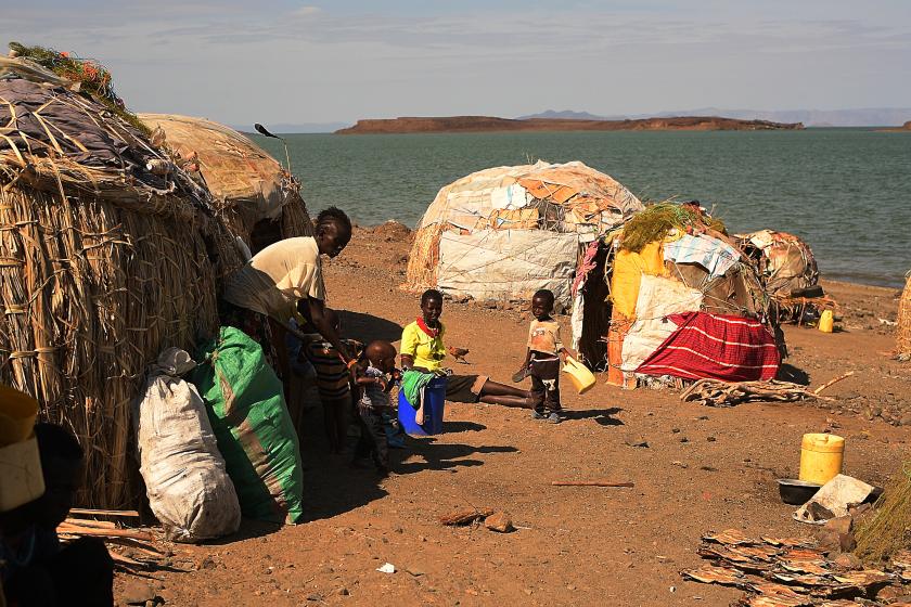 A family of El-molo community sit outside their new makeshift house after being forced to relocate following the rising waters from Lake Turkana, near Loiyangalani, northern Kenya, on July 13, 2022. At least 18 million people across the Horn of Africa are facing severe hunger as the worst drought in 40 years devastates the region. Over four million are in Kenya's often-forgotten north, a number that has climbed steadily this year, as the crisis struggles to attract national attention in the midst of a hard-fought -- and expensive -- election campaign. Simon MAINA / AFP A family of El-molo community sit outside their new makeshift house after being forced to relocate following the rising waters from Lake Turkana, near Loiyangalani, northern Kenya, on July 13, 2022. At least 18 million people across the Horn of Africa are facing severe hunger as the worst drought in 40 years devastates the region. Over four million are in Kenya's often-forgotten north, a number that has climbed steadily this year, as the crisis struggles to attract national attention in the midst of a hard-