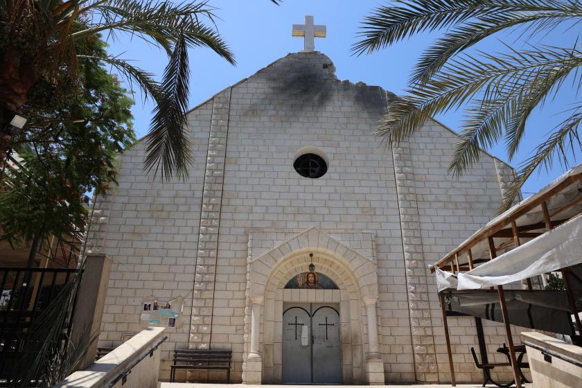 A picture shows a view of a damaged facade of the Holy Family Church, a day after it was hit in an Israeli strike, in Gaza City on July 18, 2025. Two of the most senior Christian leaders in Jerusalem travelled to Gaza, a day after an Israeli strike killed three at the Holy Family Church, the besieged Palestinian territory's only Catholic church, provoking international condemnation. Omar AL-QATTAA / AFP