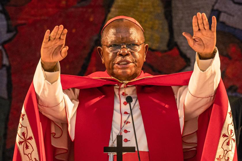 Congolese Cardinal Fridolin Ambongo Besungu speaks during a mass in commemoration of the late Pope Francis at the Notre Dame du Congo Cathedral in Kinshasa on April 21, 2025. Pope Francis, an energetic reformer who inspired widespread devotion from Catholics but riled traditionalists, died on April 21, 2025 aged 88. Hardy BOPE / AFP