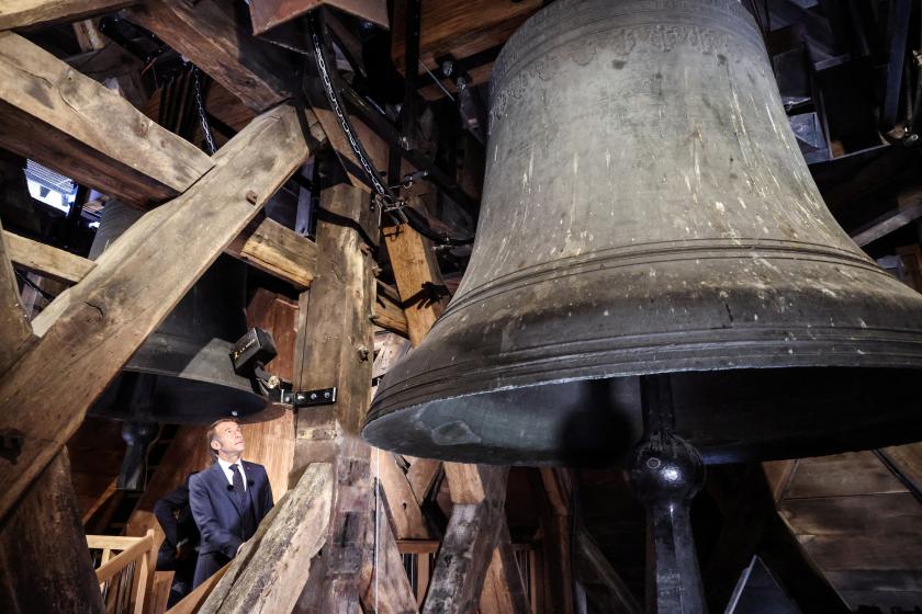 France's President Emmanuel Macron visits the bell tower of Notre-Dame de Paris Cathedral during the inauguration ceremony of the new tour route of the Cathedral Towers Gothic structures destroyed following the April 2019 fire, as part of the 42nd edition of the European Heritage Days in Paris, on September 19, 2025. The April 15, 2019 fire destroyed the roof and steeple of the 850-year-old Gothic cathedral. The tower visit circuit completes the reopening of the cathedral to the public, that occurred on Dec