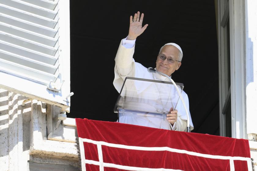 This photo taken and handout on September 21, 2025 by The Vatican Media shows Pope Leo XIV addressing the crowd from the window of the apostolic palace overlooking St. Peter's square during the Angelus prayer in The Vatican. Handout / VATICAN MEDIA / AFP