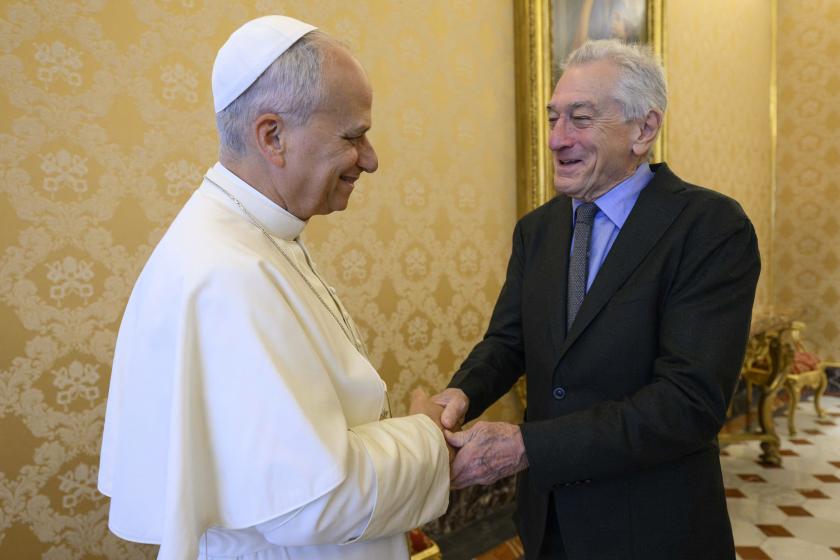 A handout photograph taken on November 7, 2025 and released by Vatican Media, the Vatican Press Office, shows Pope Leo XIV (L) shaking hands with US actor Robert De Niro during a private audience at the Vatican. VATICAN MEDIA / AFP