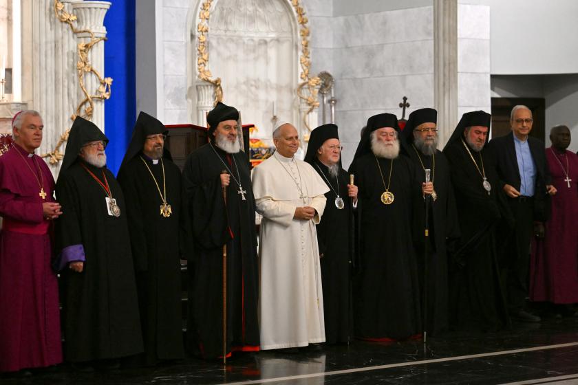 Pope Leo XIV stands between patriarch Mor Ignatius Aphrem II (L) and patriarch Bortholomew I as he arrives for a private meeting with religious leaders at the Mor Ephrem Syriac Orthodox Church, in Istanbul on November 29, 2025.  Andreas SOLARO / AFP