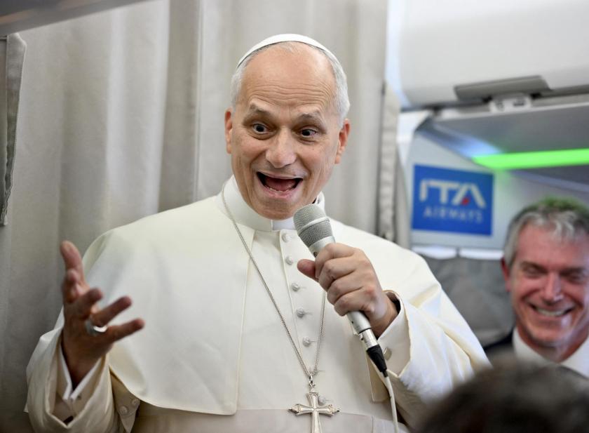 Pope Leo XIV speaks to journalists aboard a flight to Rome at the end of his apostolic journey to Turkey and Lebanon, on December 2, 2025.  Alessandro DI MEO / POOL / AFP
