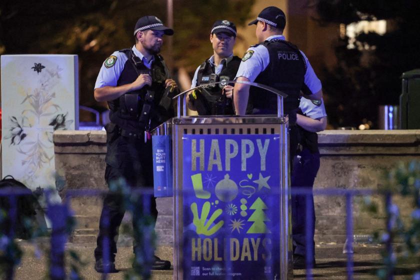 Police work on a street after a shooting incident at Bondi Beach in Sydney on December 14, 2025. Australian police said two people were in custody following reports of multiple gunshots on December 14 at Sydney's famed Bondi Beach, urging the public to take shelter. DAVID GRAY / AFP