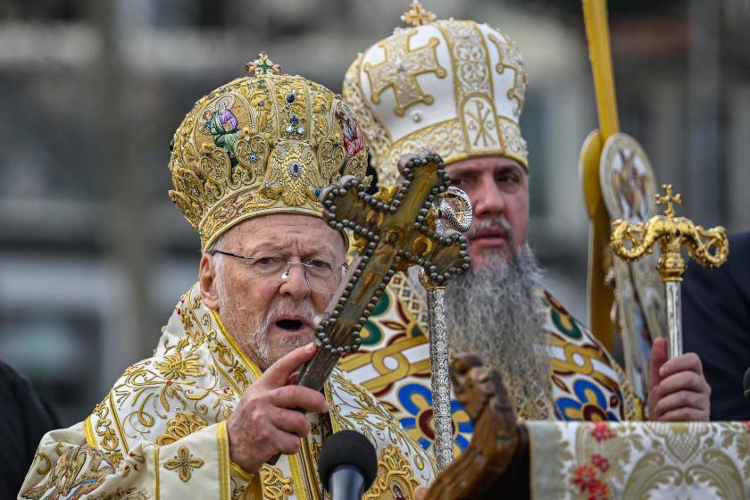 Greek Orthodox Ecumenical Patriarch Bartholomew I of Constantinople (L) and Epiphanius (R) head of Orthodox Ukraine church and Metropolitan of Kyiv attend a ritual to mark the Epiphany Day in Istanbul on January 6, 2026.  Ozan KOSE / AFP