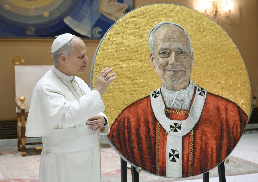 A handout picture provided by the Vatican Media shows Pope Leo XIV looking at a mosaic dedicated to him that has been completed, in Vatican City, 14 January 2026. The round mosaic was made for the Basilica of St. Paul Outside the Walls in Rome. EPA/VATICAN MEDIA HANDOUT HANDOUT EDITORIAL USE ONLY/NO SALES