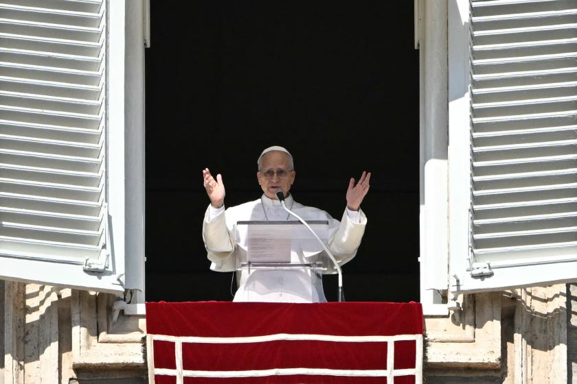 Pope Leo XIV addresses the crowd from the window of the apostolic palace overlooking St. Peter's square during the Angelus prayer in the Vatican on February 15, 2026. Andreas SOLARO / AFP