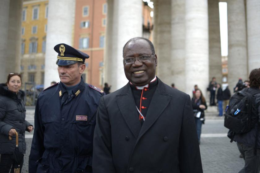 Tanzanian cardinal Polycarp Pengo walks on St Peter's square after a cardinals' meeting on the eve of the start of a conclave on March 11, 2013 at the Vatican. Cardinals will hold a final set of meetings on Monday before they are locked away to choose a new pope to lead the Roman Catholic Church through troubled times. AFP PHOTO / JOHANNES EISELE