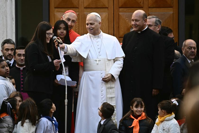 Pope Leo XIV meets with residents as he arrives for a pastoral visit to the parish of the "Sacred Heart of Jesus" in the Castro Pretorio neighborhood of Rome, on February 22, 2026.  Filippo MONTEFORTE / AFP