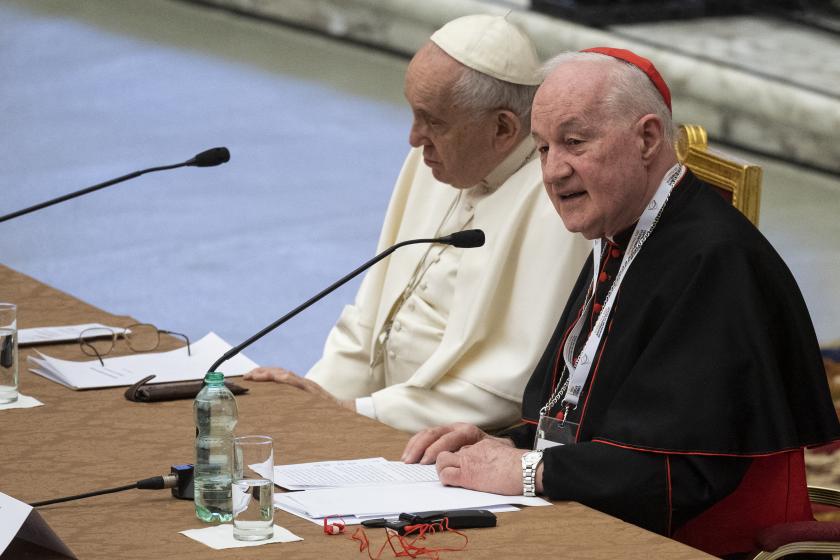 Pope Francis sits along side Cardinal Marc Ouellet (R) of Canada during Symposium on priesthood in the Paul VI hall at the Vatican on February 17, 2022.  Tiziana FABI / AFP