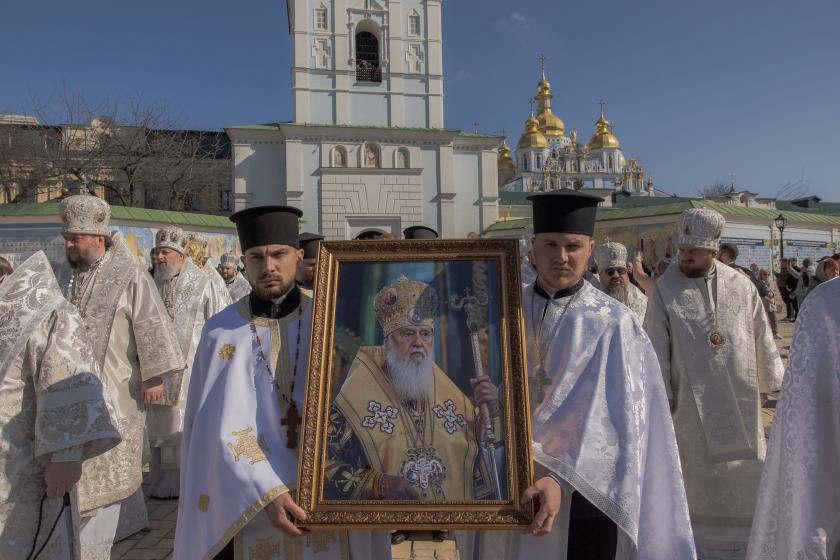 Clergy carry the portrait of the late Patriarch Filaret during a funeral procession outside of St. Michael’s Golden-Domed Monastery in Kyiv on March 22, 2026, amid the Russian invasion of Ukraine. The Patriarch was a central player in establishing an independent Ukrainian Church in the 1990s, breaking from the Russian Church, which has become increasingly entwined with the Kremlin supporting Russia's war on Ukraine. Roman PILIPEY / AFP