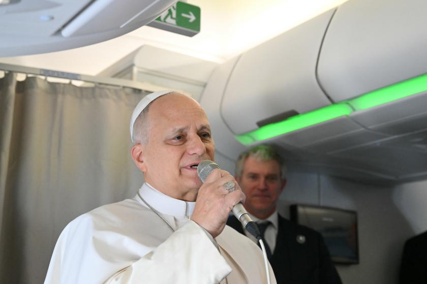 Pope Leo XIV addresses journalists during the flight heading to Algiers on April 13, 2026. Pope Leo XIV embarks today on an 11-day visit to Algeria, Cameroon, Angola and Equatorial Guinea for his first major international trip since becoming pontiff last year. Alberto PIZZOLI / POOL / AFP