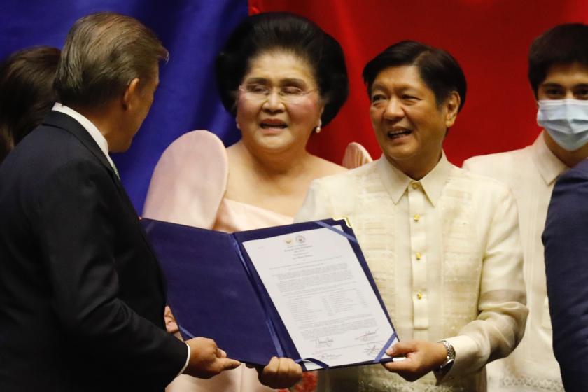 Philippines President-elect Ferdinand 'Bongbong' Marcos (C-R) with his mother, Imelda Marcos (C), receives a document during his proclamation at the House of Congress in Quezon City, Metro Manila, Philippines, 25 May 2022. Ferdinand 'Bongbong' Marcos Junior, son of late President Ferdinand Marcos, was proclaimed president-elect ahead of his official swearing-in ceremony as the 17th Philippine head of state. EPA/FRANCIS R. MALASIG Philippines President-elect Ferdinand 'Bongbong' Marcos (C-R) with his mother, Imelda Marcos (C), receives a document during his proclamation at the House of Congress in Quezon City, Metro Manila, Philippines, 25 May 2022. Ferdinand 'Bongbong' Marcos Junior, son of late President Ferdinand Marcos, was proclaimed president-elect ahead of his official swearing-in ceremony as the 17th Philippine head of state.